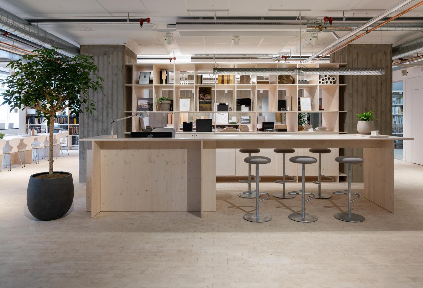 Table with bar stools in office landscape. Photo