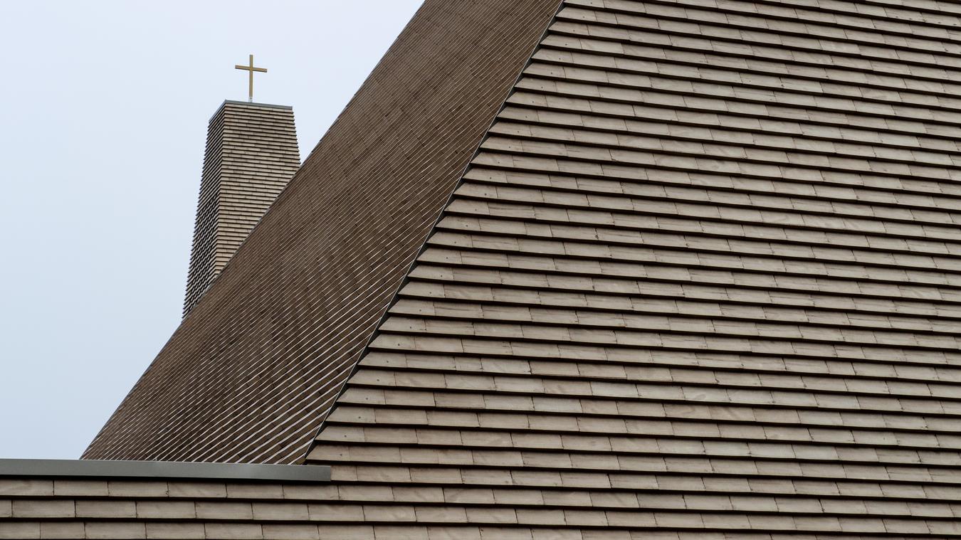 Facade detail brick and church spire. Photo