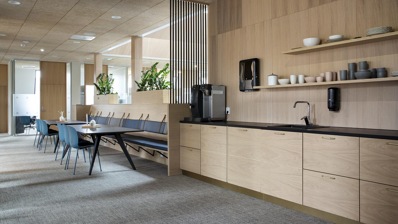 Open kitchen with wooden fronts. Photo