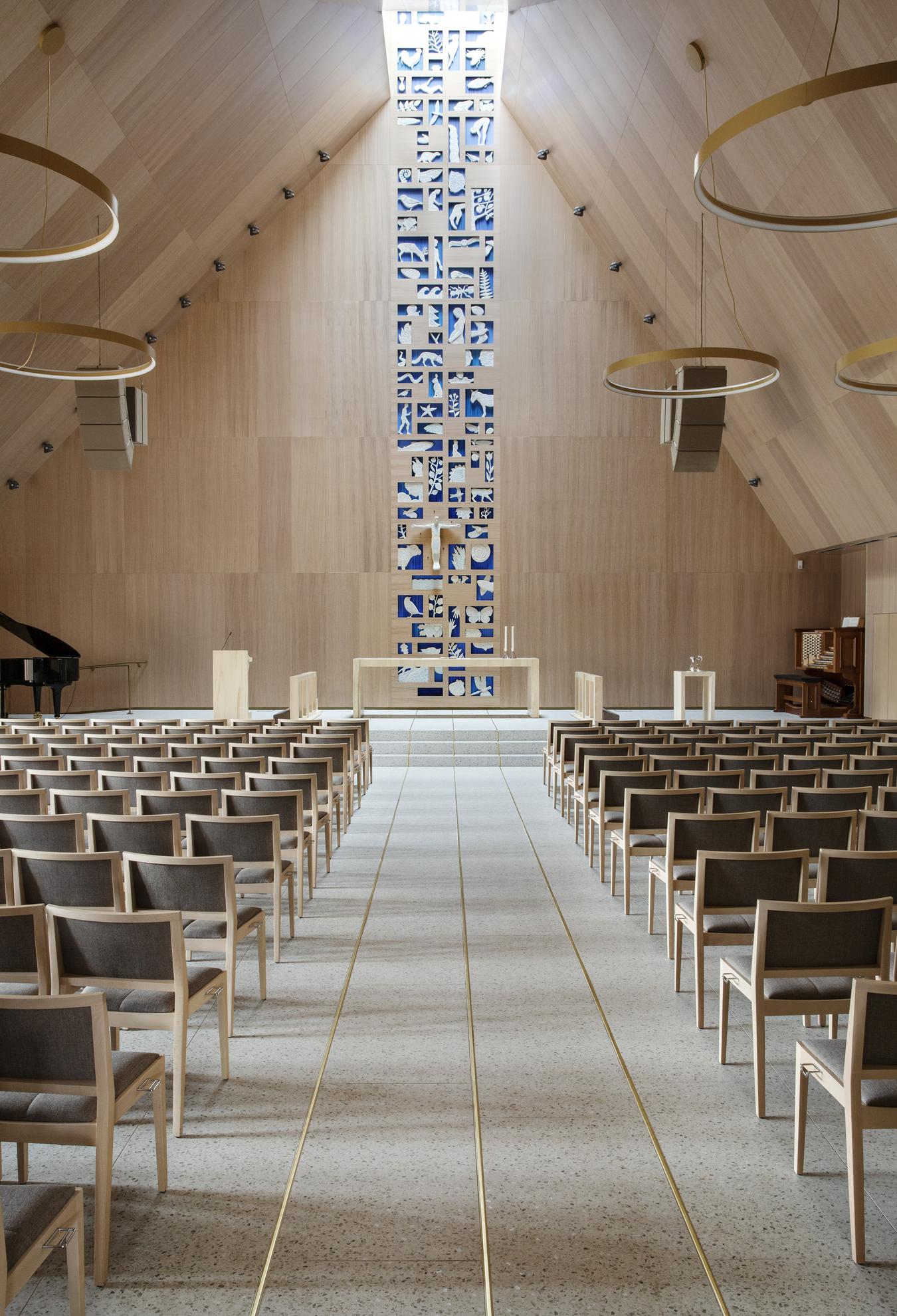 Open church room with natural light from the ceiling. Photo